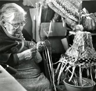Eliza Abrahams weaving Cedar Bark hat.
