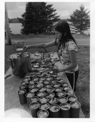 Young Girl Canning Fish in Old Massett