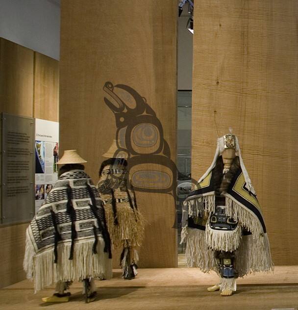 Naaxiin outfit on wooden mannequin with headdress and staff