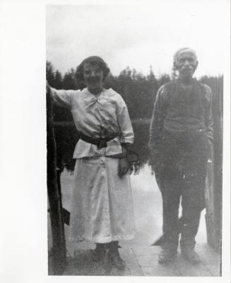Man and Woman Standing on Dock
