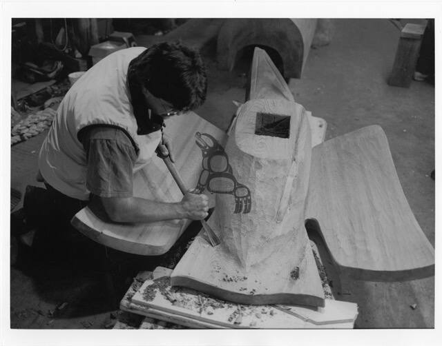 Derek White Carving a Raven Sculpture