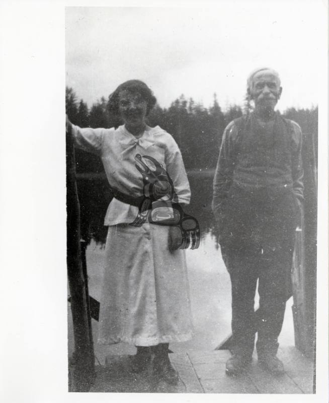 Man and Woman Standing on Dock