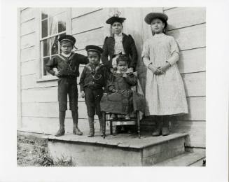 Young woman and children in Skidegate